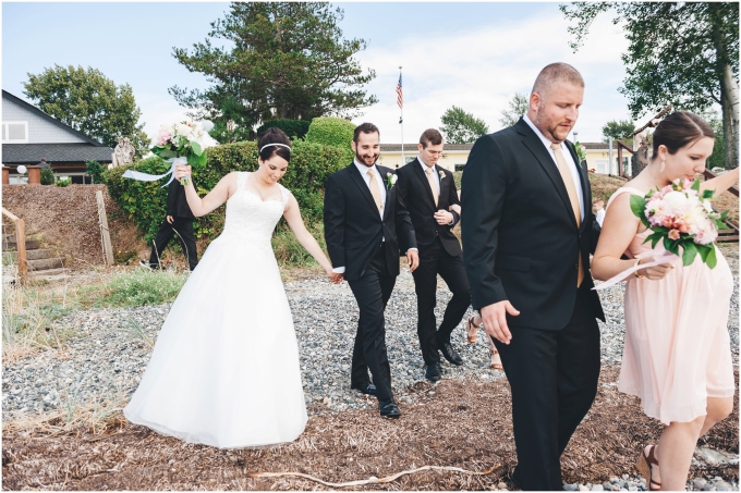 Photo of wedding party walking on the beach in Bellingham